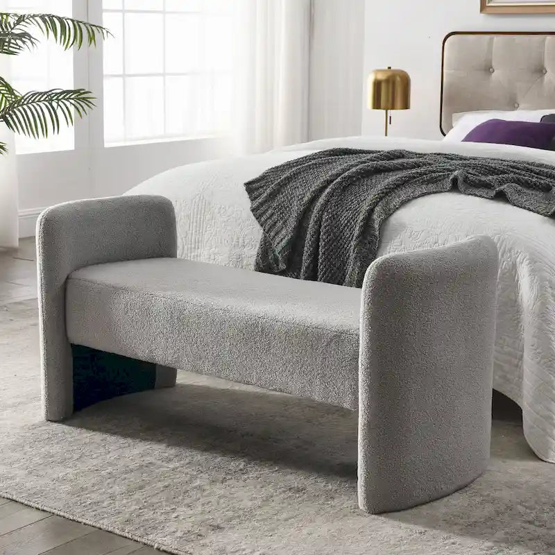 Banc capitonné en polyester avec piètement en H, design moderne et polyvalent.
