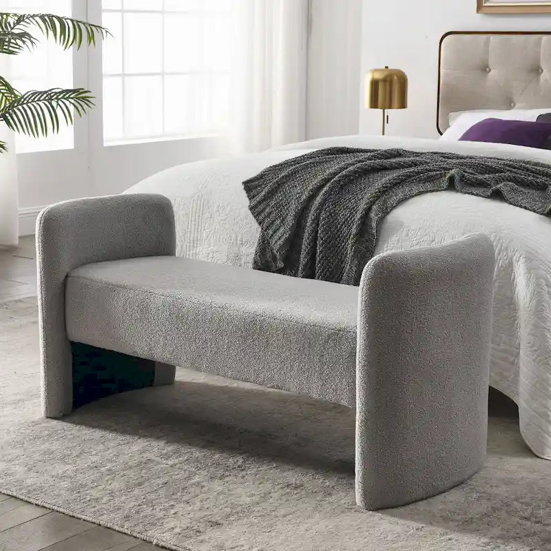Banc capitonné en polyester avec piètement en H, design moderne et polyvalent.
