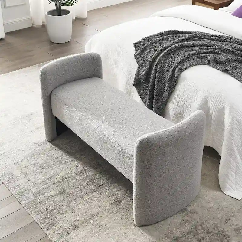 Banc capitonné en polyester avec piètement en H, design moderne et polyvalent.