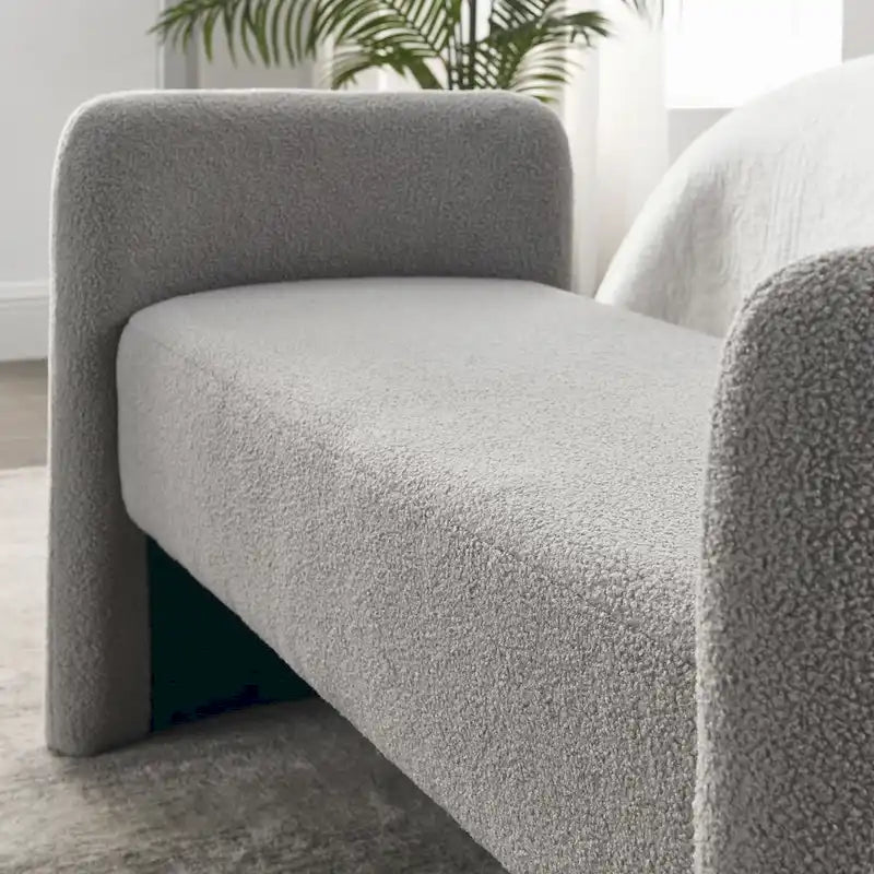 Banc capitonné en polyester avec piètement en H, design moderne et polyvalent.