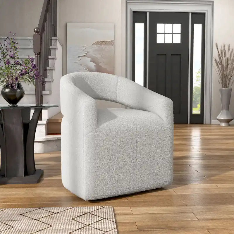 Fauteuil moderne de forme cylindrique avec dossier ajouré et accoudoirs incurvés ; fauteuil pivotant.