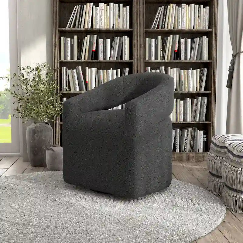 Fauteuil moderne de forme cylindrique avec dossier ajouré et accoudoirs incurvés ; fauteuil pivotant.