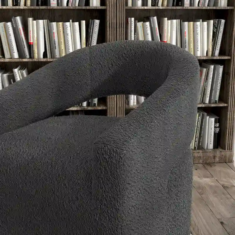Fauteuil moderne de forme cylindrique avec dossier ajouré et accoudoirs incurvés ; fauteuil pivotant.