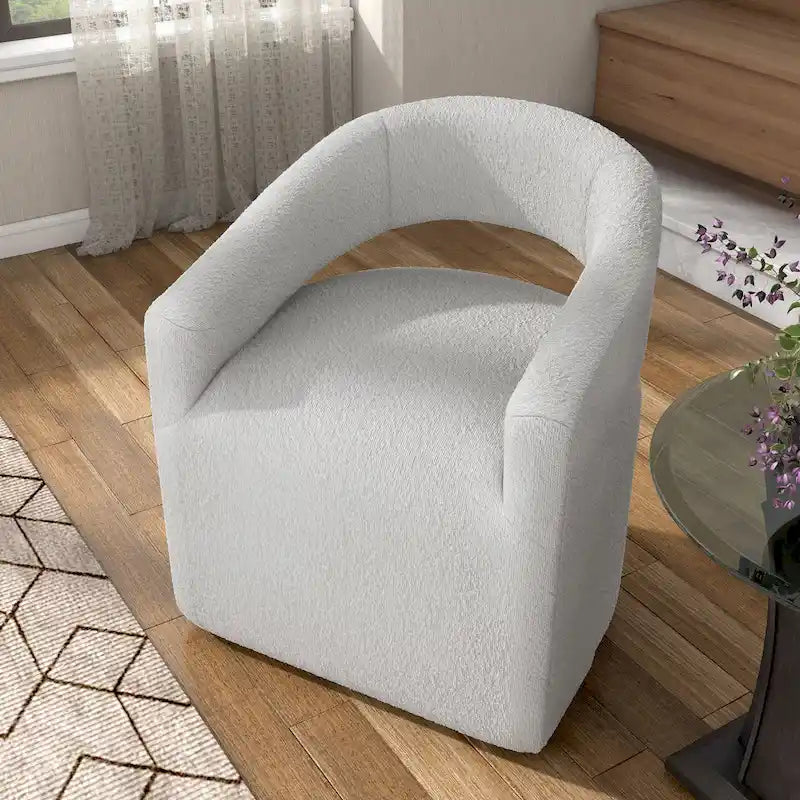 Fauteuil moderne de forme cylindrique avec dossier ajouré et accoudoirs incurvés ; fauteuil pivotant.