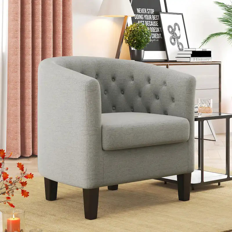 Fauteuil club capitonné en tissu