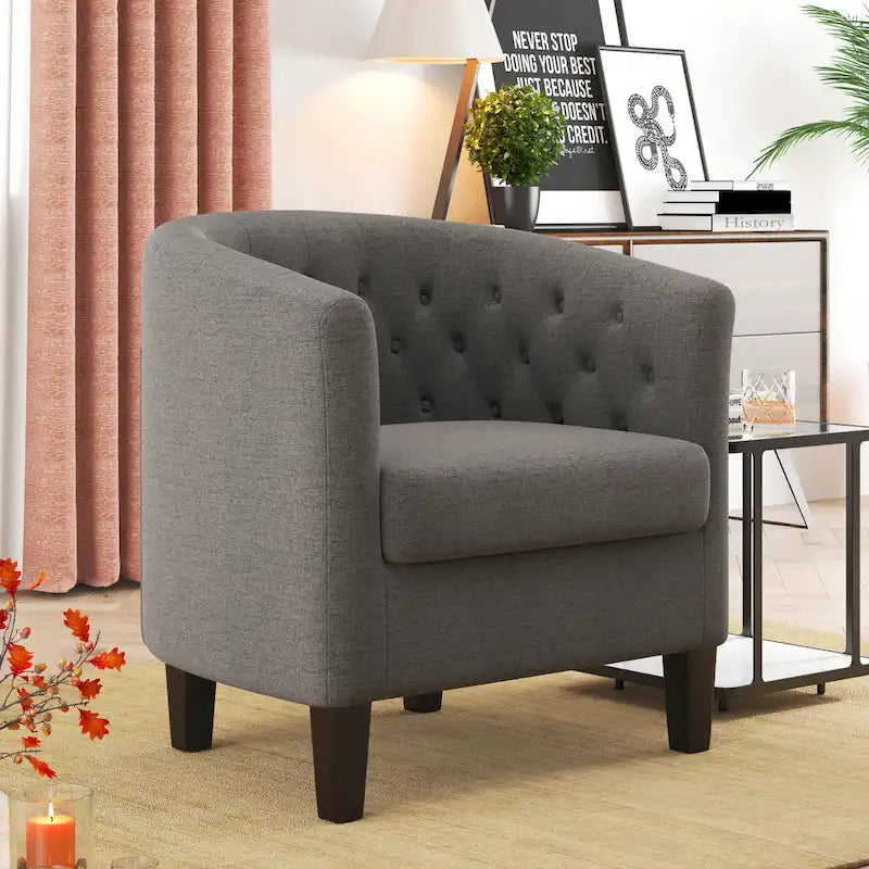 Fauteuil club capitonné en tissu