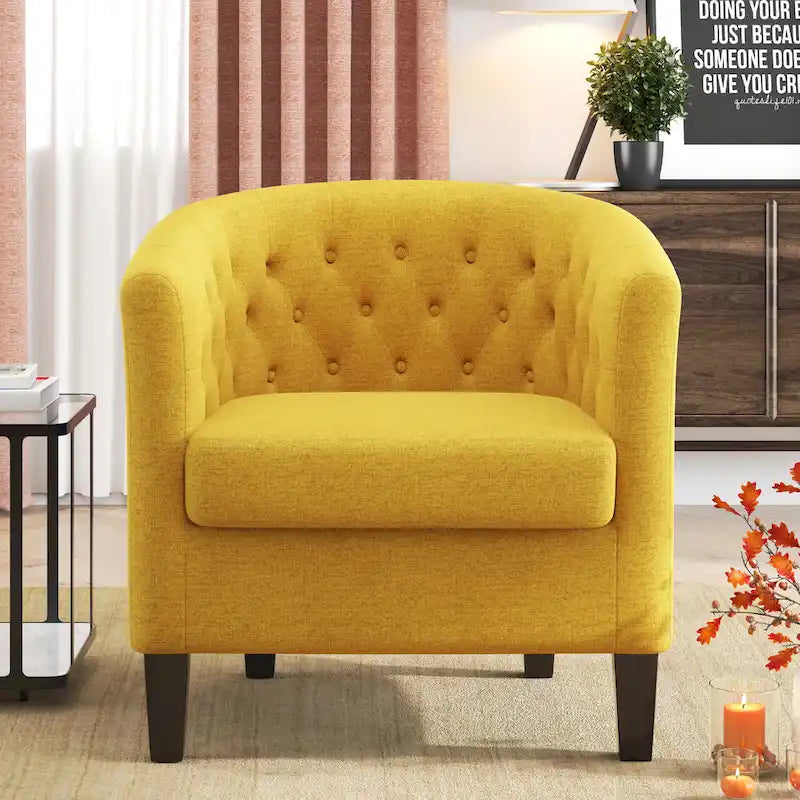 Fauteuil club capitonné en tissu