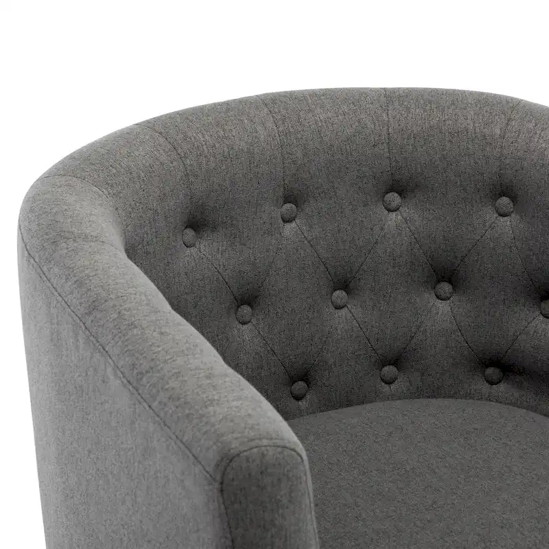 Fauteuil club capitonné en tissu