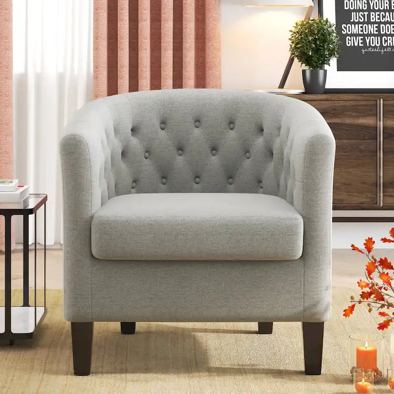 Fauteuil club capitonné en tissu