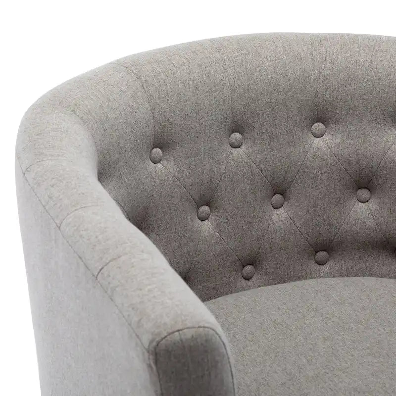 Fauteuil club capitonné en tissu